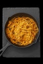 Spaghetti bolognese cooked in a cast iron frying pan. Royalty Free Stock Photo