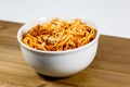 Spaghetti Bolognese in a deep white bowl on the wooden kitchen table waiting to be eaten Royalty Free Stock Photo