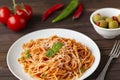 Spaghetti bolognese pasta with tomato sauce and minced meat, grated parmesan cheese and fresh basil Royalty Free Stock Photo