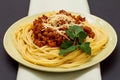 Spaghetti bolognese on a plate with kitchen napkin Royalty Free Stock Photo