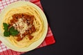 Spaghetti bolognese on a plate with kitchen napkin Royalty Free Stock Photo