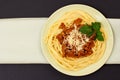 Spaghetti bolognese on a plate with kitchen napkin Royalty Free Stock Photo