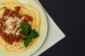 Spaghetti bolognese on a plate with kitchen napkin Royalty Free Stock Photo