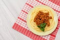 Spaghetti bolognese on a plate and napkin Royalty Free Stock Photo