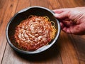 Spaghetti Bolognese ready meal in black plastic container on wooden table. Premium, high quality traditional Italian style ready Royalty Free Stock Photo