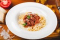 Spaghetti bolognese with tomato sauce, minced meat and grated parmesan cheese. Royalty Free Stock Photo