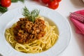 Spaghetti bolognese on white plate