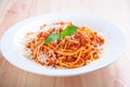Spaghetti bolognese on white plate with tomato sauce and basil Royalty Free Stock Photo