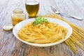 Spaghetti with bottarga on wooden table Royalty Free Stock Photo