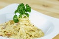 Spaghetti Cabonara with creamy sauce on wooden table Royalty Free Stock Photo