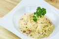 Spaghetti Cabonara with creamy sauce on wooden table Royalty Free Stock Photo