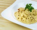 Spaghetti Cabonara with creamy sauce on wooden table Royalty Free Stock Photo