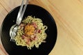 Spaghetti cabonara with ham on wood table Royalty Free Stock Photo
