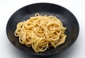 Spaghetti cacio e pepe isolated on white background