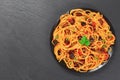 Spaghetti with capers. olives, anchovies, tomato sauce