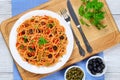 Spaghetti with capers. olives, anchovies, tomato sauce