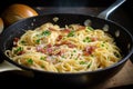 spaghetti carbonara being cooked in a skillet, with bacon and eggs frying