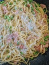 Spaghetti carbonara in a black pan Royalty Free Stock Photo