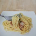 Spaghetti carbonara and fried baconon