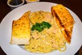 Spaghetti Carbonara and garlic bread Royalty Free Stock Photo