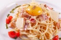 Spaghetti Carbonara. Italian Pasta on white plate with parmesan, ham and yolk Royalty Free Stock Photo