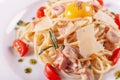 Spaghetti Carbonara. Italian Pasta on white plate with parmesan, ham and yolk Royalty Free Stock Photo