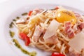 Spaghetti Carbonara. Italian Pasta on white plate with parmesan, ham and yolk Royalty Free Stock Photo