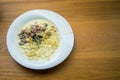 Spaghetti carbonara mushroom cream sauce ham in white dish traditional Italian cuisine style Royalty Free Stock Photo