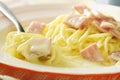 Spaghetti carbonara topping slice ham pork rolled on fork Royalty Free Stock Photo