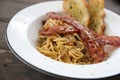 Spaghetti carbonara Spaghetti white sauce with cheese bacon in outdoor restaurant italian food Royalty Free Stock Photo