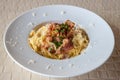 Spaghetti Carbonara on wooden table. Classic homemade carbonara pasta with pancetta.  Carbonara pasta, spaghetti with bacon,egg,ch Royalty Free Stock Photo
