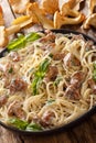 Spaghetti with chanterelle mushrooms in cream sauce with basil close-up on a plate. vertical Royalty Free Stock Photo