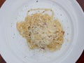 spaghetti with cheese and pepper on a white plate Royalty Free Stock Photo