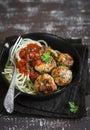 Spaghetti and chicken meatballs with tomato sauce in a pan Royalty Free Stock Photo