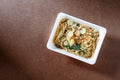 Spaghetti with chili pork basil leaf in food container.Top view. Royalty Free Stock Photo