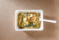 Spaghetti with chili pork basil leaf in food container.Top view. Royalty Free Stock Photo