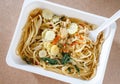 Spaghetti with chili pork basil leaf in food container.Top view. Royalty Free Stock Photo