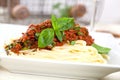 Spaghetti dinner with meat sauce and basil close up Bolognese. Royalty Free Stock Photo