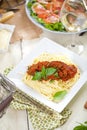 Spaghetti dinner with meat sauce and basil close up Bolognese. Royalty Free Stock Photo