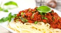 Spaghetti dinner with meat sauce and basil close up Bolognese. Royalty Free Stock Photo