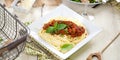 Spaghetti dinner with meat sauce and basil close up Bolognese. Royalty Free Stock Photo