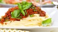 Spaghetti dinner with meat sauce and basil close up Bolognese. Royalty Free Stock Photo