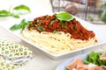 Spaghetti dinner with meat sauce and basil close up Bolognese. Royalty Free Stock Photo