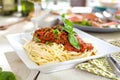 Spaghetti dinner with meat sauce and basil close up Bolognese. Royalty Free Stock Photo