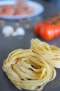 Spaghetti and fettuccine with ingredients for cooking pasta Royalty Free Stock Photo