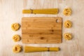 Spaghetti and fettuccine on a wooden background around a bamboo Board
