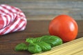 Spaghetti, fresh tomato and basil leaves Royalty Free Stock Photo