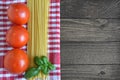 Spaghetti, fresh tomatoes and basil leaves