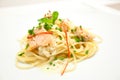 Spaghetti with salmon, cream cheese and spinach close-up on white plate Royalty Free Stock Photo