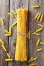 Spaghetti on the grey wooden background